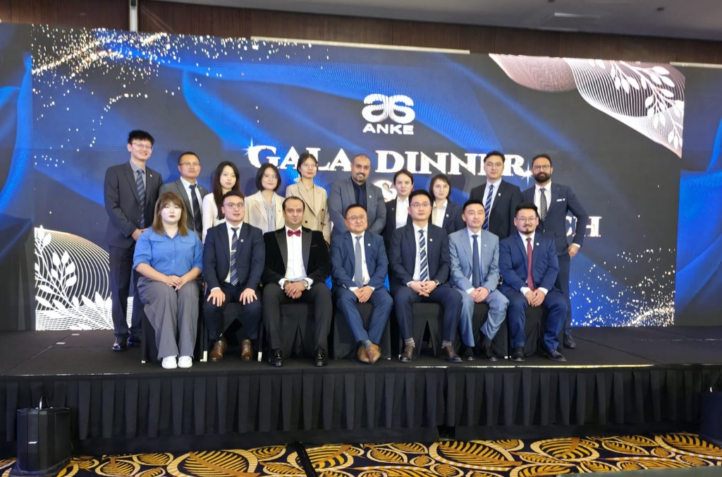 ANKE Gala Dinner — formal team photo with branded backdrop.